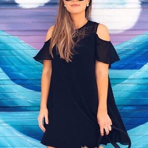 Black swing dress with sleeve cutout